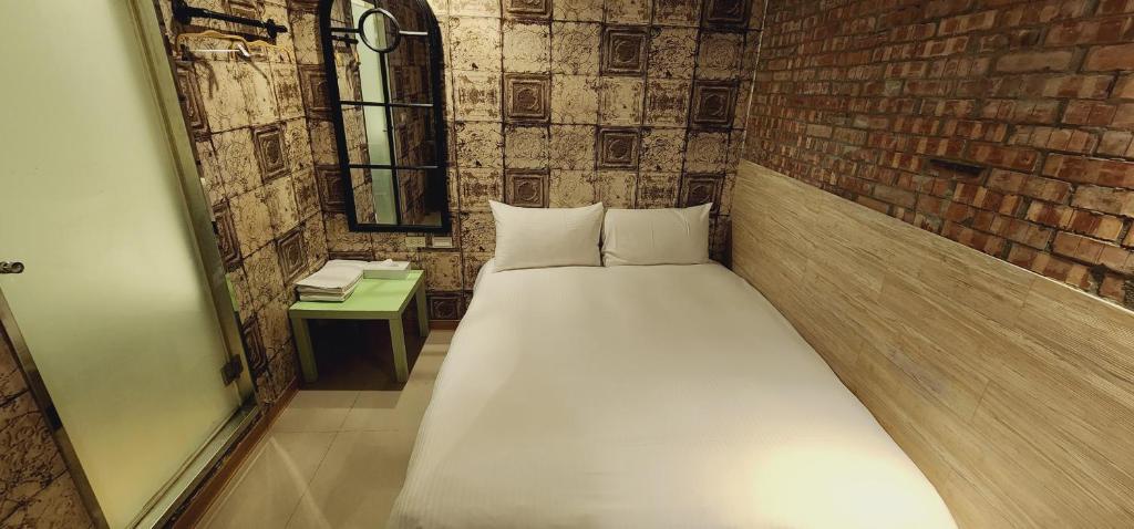 Postel nebo postele na pokoji v ubytování 慶爾喜旅館長沙館Cheers Loft Self Check-in Hotel