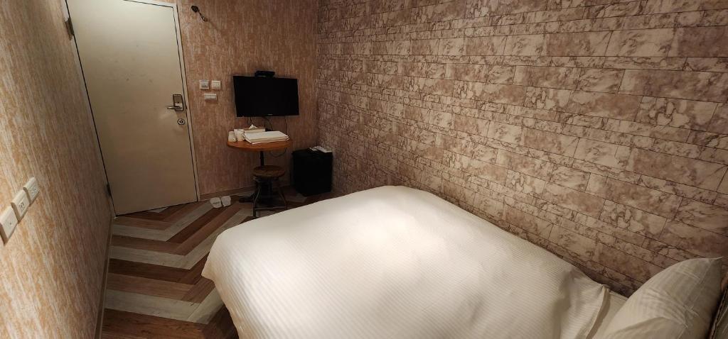 Postel nebo postele na pokoji v ubytování 慶爾喜旅館長沙館Cheers Loft Self Check-in Hotel