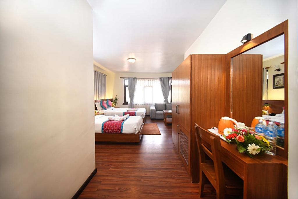 Postel nebo postele na pokoji v ubytování Hotel Amaryllis Kathmandu