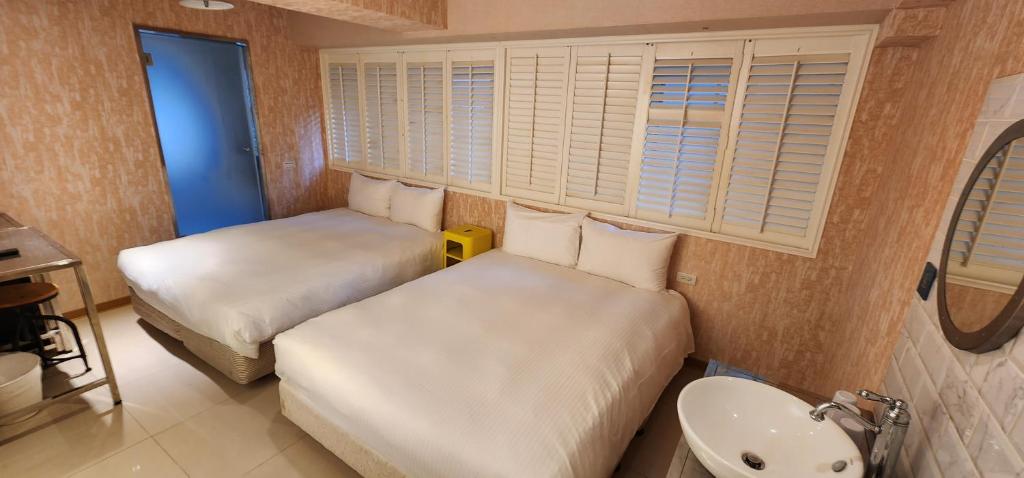 Postel nebo postele na pokoji v ubytování 慶爾喜旅館長沙館Cheers Loft Self Check-in Hotel