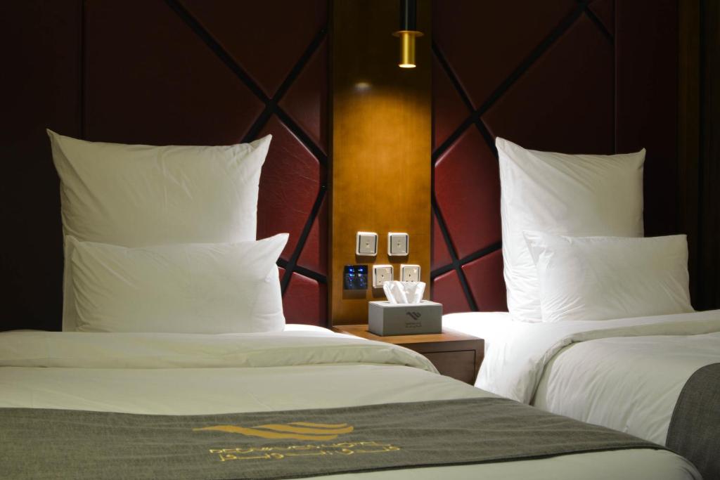 Postel nebo postele na pokoji v ubytování Redwaves Hotel فندق ريدويفز
