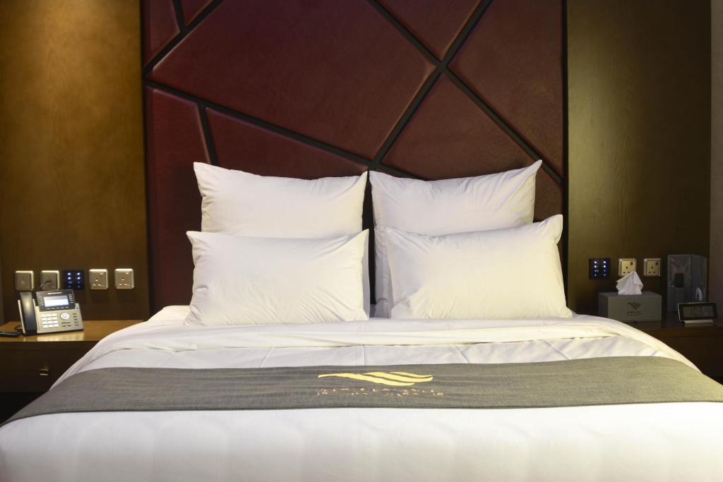 Postel nebo postele na pokoji v ubytování Redwaves Hotel فندق ريدويفز