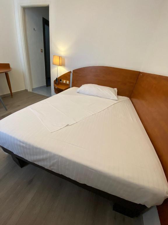 Postel nebo postele na pokoji v ubytování Hotel Admiral