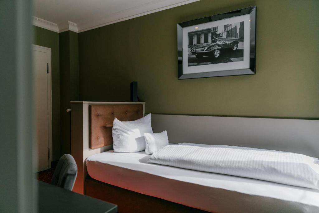 Postel nebo postele na pokoji v ubytování Hotel Fletzinger