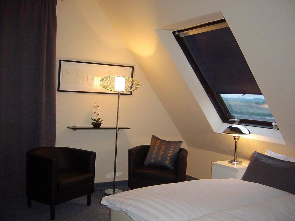 Postel nebo postele na pokoji v ubytování Hotel Palatino