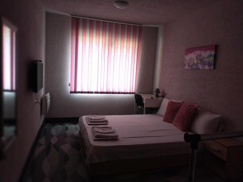 A bed or beds in a room at Vila Nova