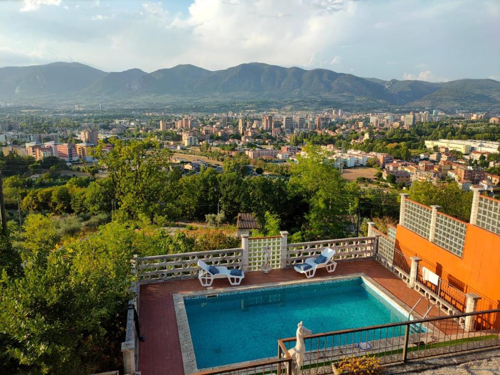 a swimming pool on top of a house with a city at Antica Terrazza in Terni