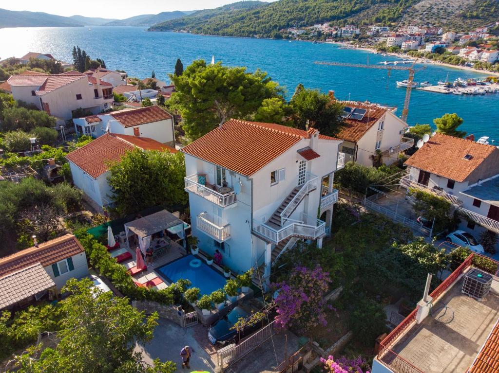 an aerial view of a house with a swimming pool at Villa Danijela with heated pool,jacuzzi and sauna in Seget Vranjica