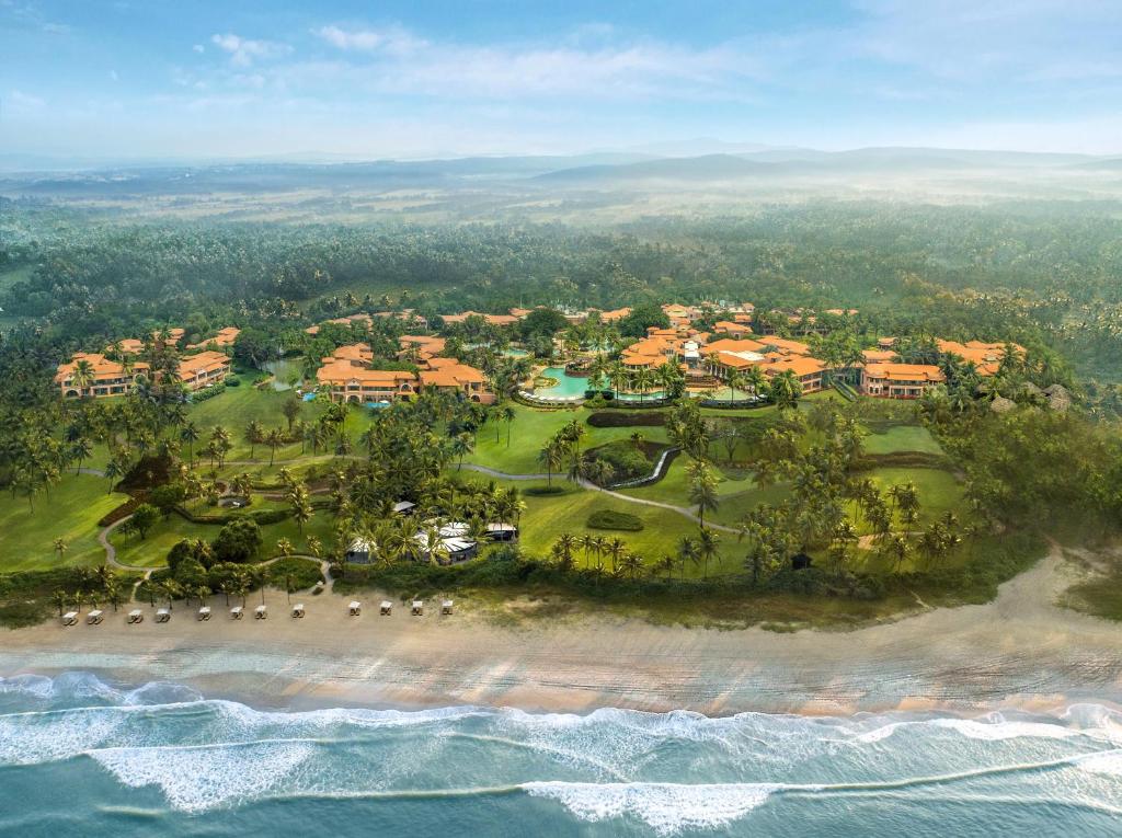 an aerial view of a resort next to the ocean at ITC Grand Goa, a Luxury Collection Resort & Spa, Goa in Utorda