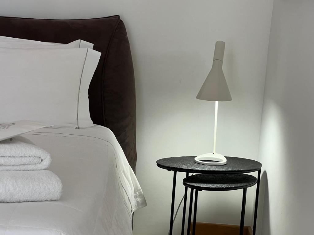 Postel nebo postele na pokoji v ubytování Santacroce Luxury Rooms