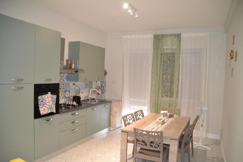 a kitchen with a table and a dining room at Best Residence **** in Termoli
