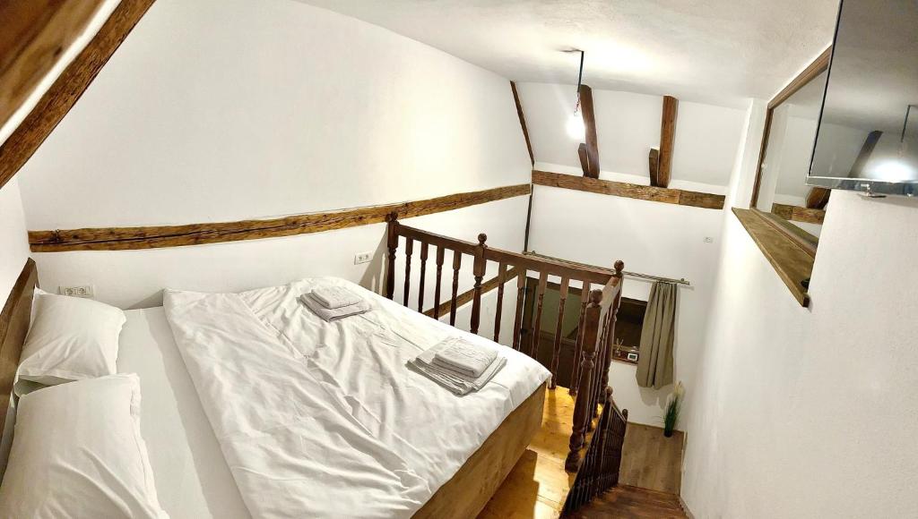 Postel nebo postele na pokoji v ubytování Casa de Lemn Arpasu de jos