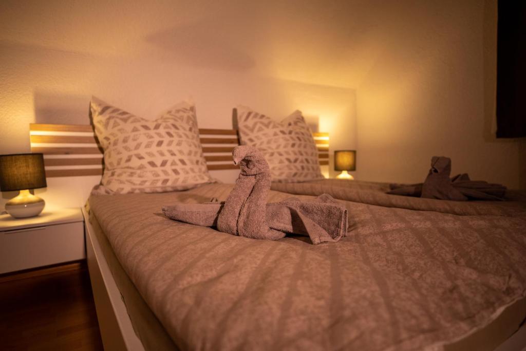 a bedroom with two beds with stuffed animals on them at Hochrhein Ferienwohnung in Albbruck
