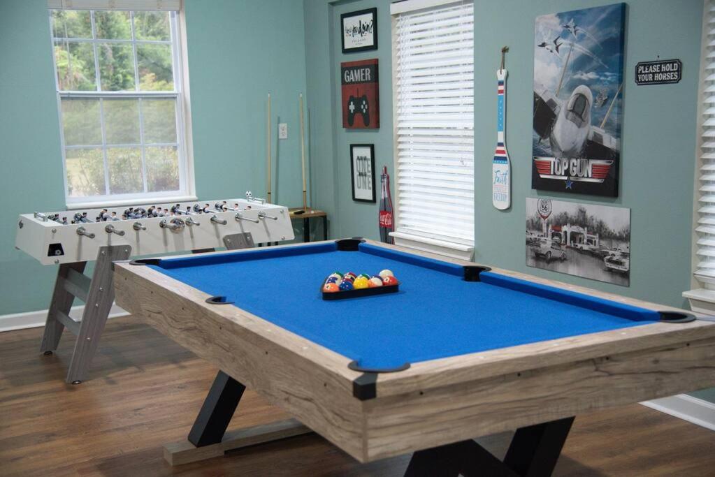 a living room with a pool table in it at Spacious Home near Gulf Shores & Orange Beach in Foley