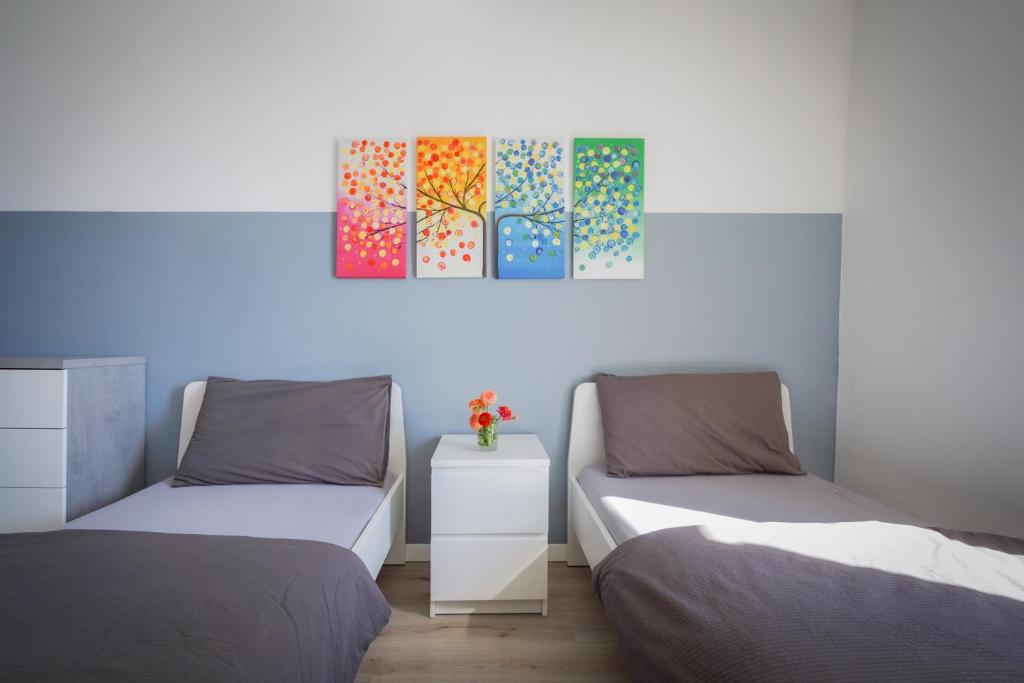 Postel nebo postele na pokoji v ubytování appartamento LA SORTIVA