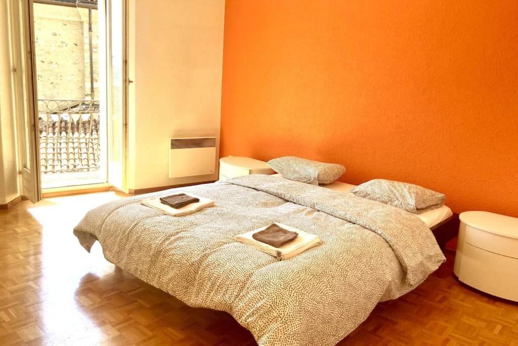 a bedroom with a bed with two plates on it at Casa Alta in Lugano