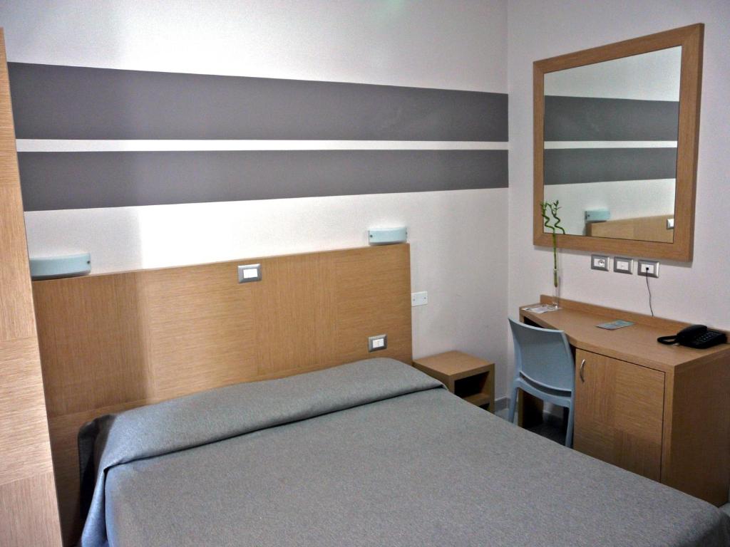 Postel nebo postele na pokoji v ubytování Hotel La Scaletta
