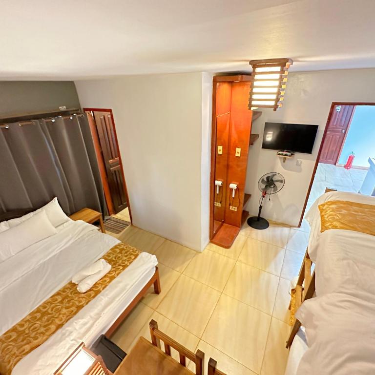Postel nebo postele na pokoji v ubytování Earl De Princesa Hotel