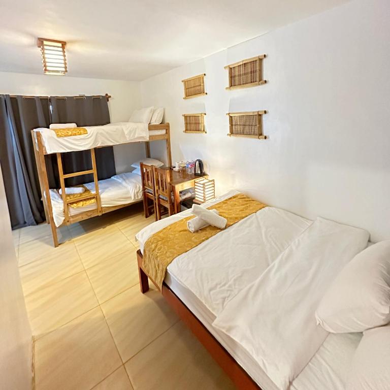 Postel nebo postele na pokoji v ubytování Earl De Princesa Hotel