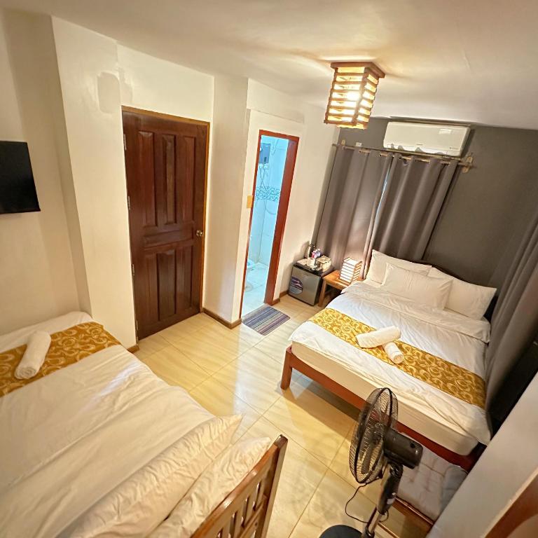 Postel nebo postele na pokoji v ubytování Earl De Princesa Hotel