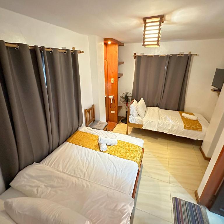 Postel nebo postele na pokoji v ubytování Earl De Princesa Hotel