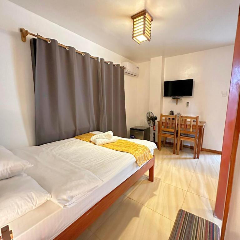 Postel nebo postele na pokoji v ubytování Earl De Princesa Hotel