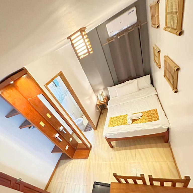 Postel nebo postele na pokoji v ubytování Earl De Princesa Hotel