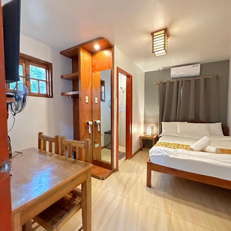 Postel nebo postele na pokoji v ubytování Earl De Princesa Hotel