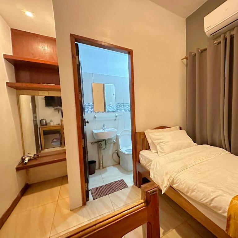 Postel nebo postele na pokoji v ubytování Earl De Princesa Hotel