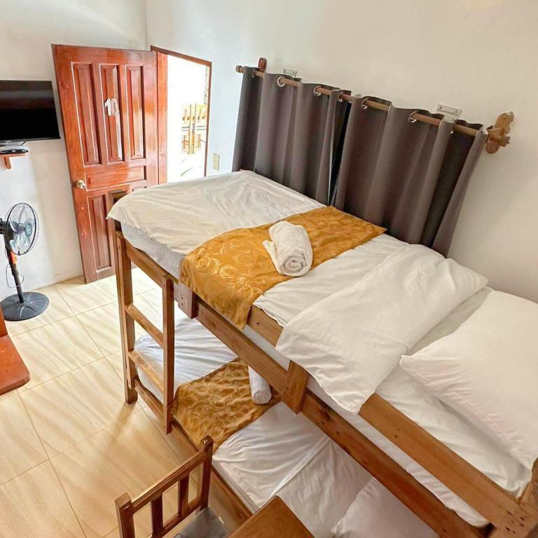Postel nebo postele na pokoji v ubytování Earl De Princesa Hotel