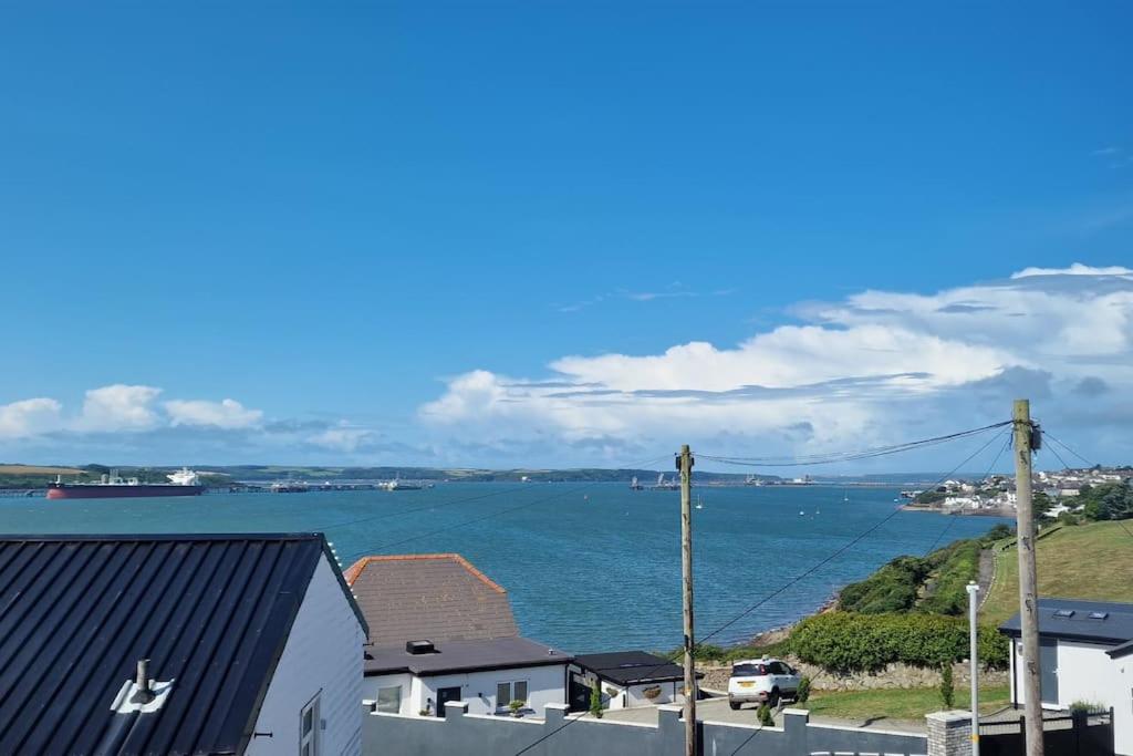 a view of the ocean from a house at Sea View Luxury 5 Star Cottage Near Milford Marina in Pembrokeshire