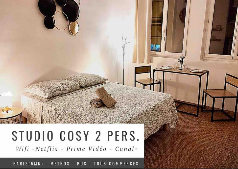 Ένα ή περισσότερα κρεβάτια σε δωμάτιο στο Studio Cosy(5mn Paris)Metro/RER