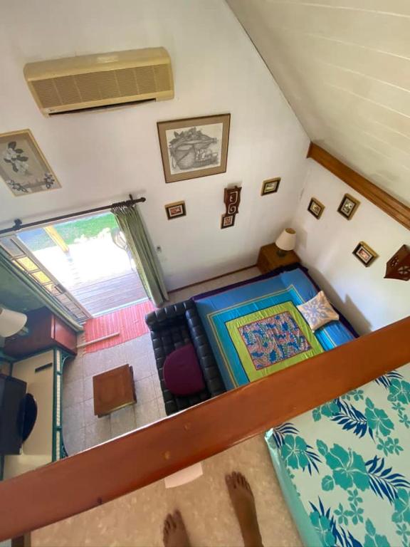 a view of a room with a bed and a window at chalet chenal in Hauru