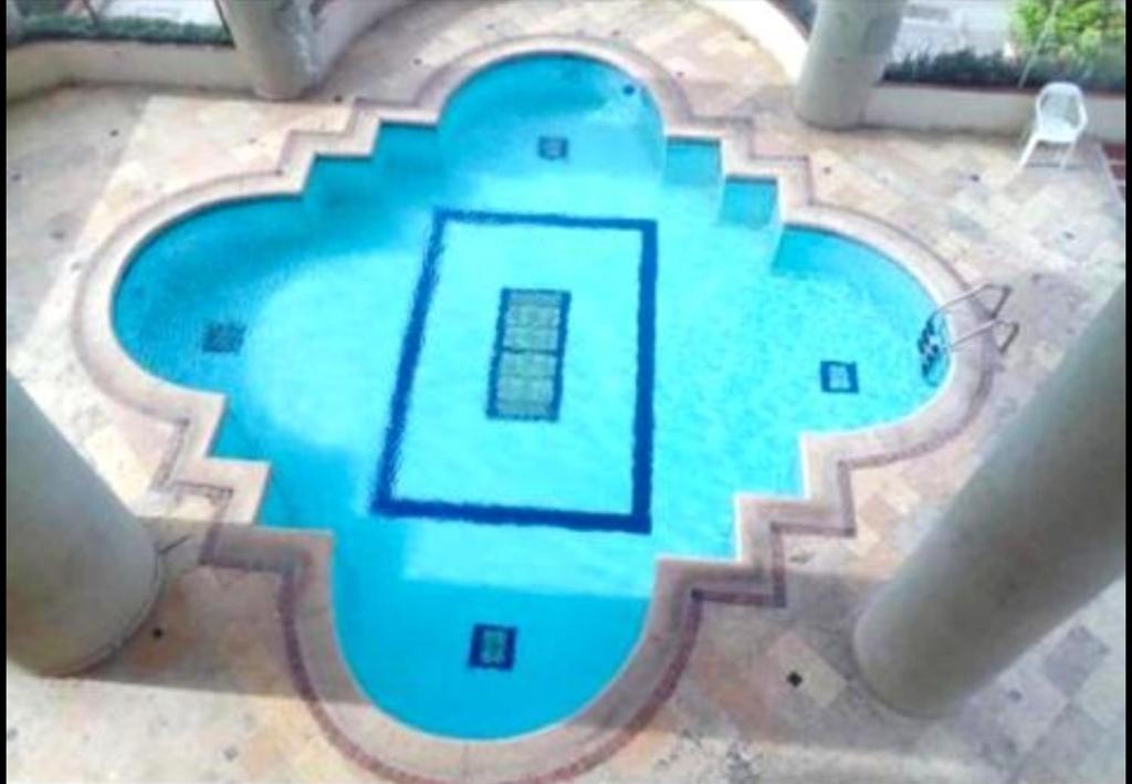 an image of a swimming pool in a backyard at Cabrero Beach 1111 in Cartagena de Indias