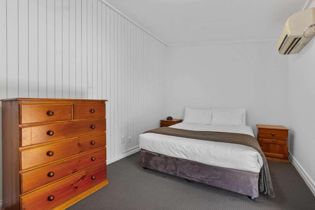 Postel nebo postele na pokoji v ubytování Econo Lodge East Adelaide