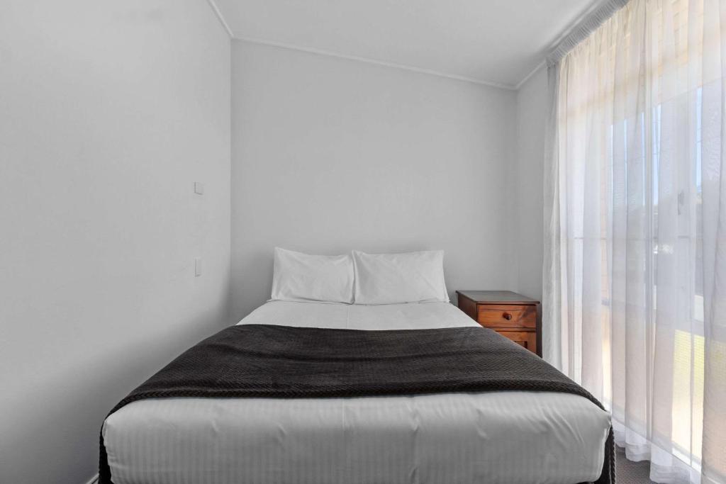 Postel nebo postele na pokoji v ubytování Econo Lodge East Adelaide