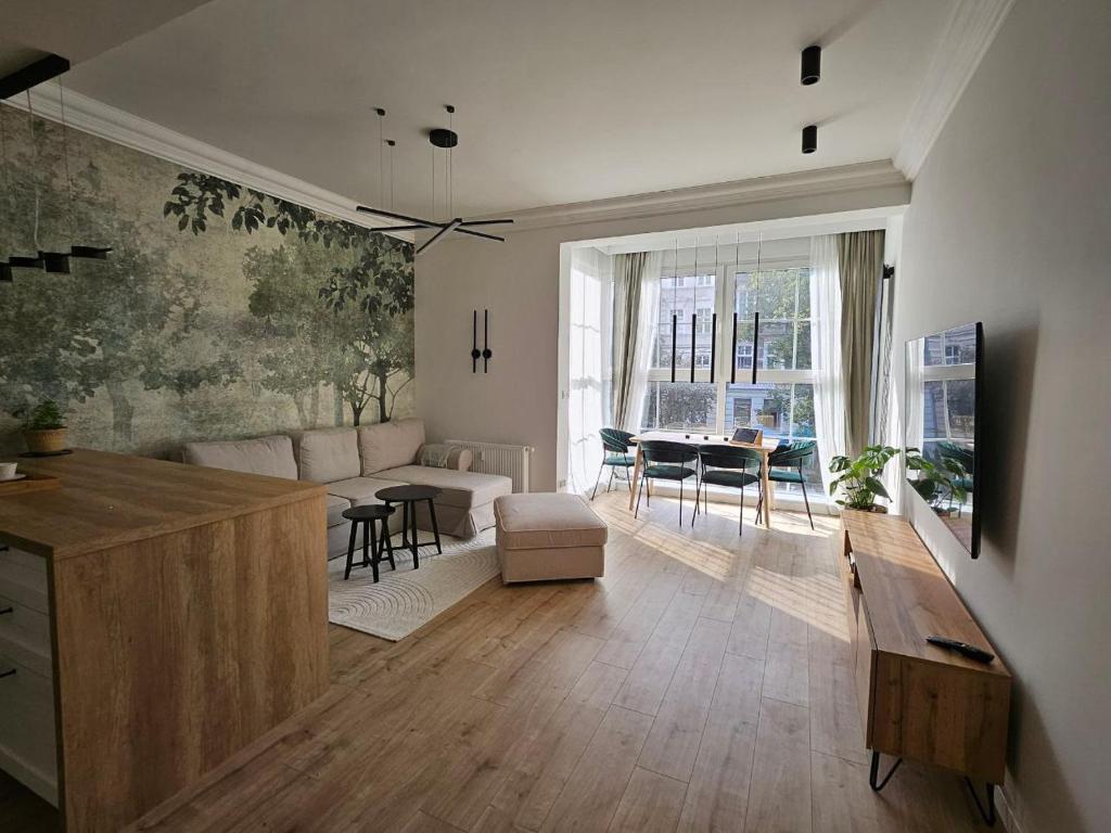a living room with a couch and a table at MIRA Apartment in My Center in Szczecin