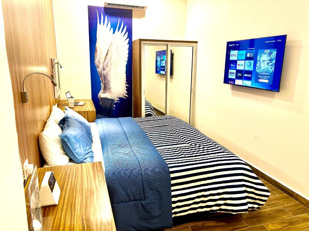 Postel nebo postele na pokoji v ubytování Sky Inn Hotel - Cancun