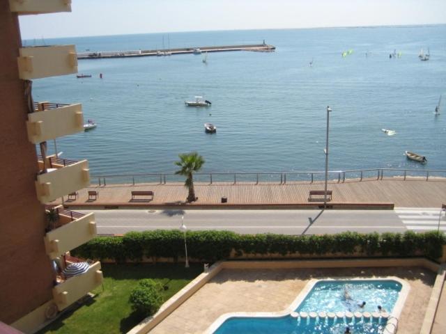a view of a body of water with a swimming pool at AMPOLLA in L'Ampolla