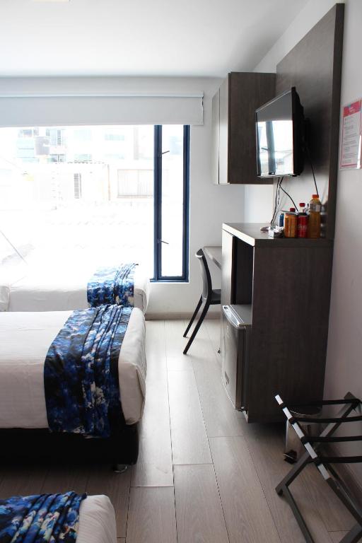 Postel nebo postele na pokoji v ubytování Agora Suites Self-Service Boutique Hotel