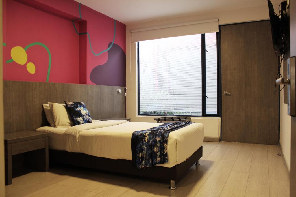 Postel nebo postele na pokoji v ubytování Agora Suites Self-Service Boutique Hotel