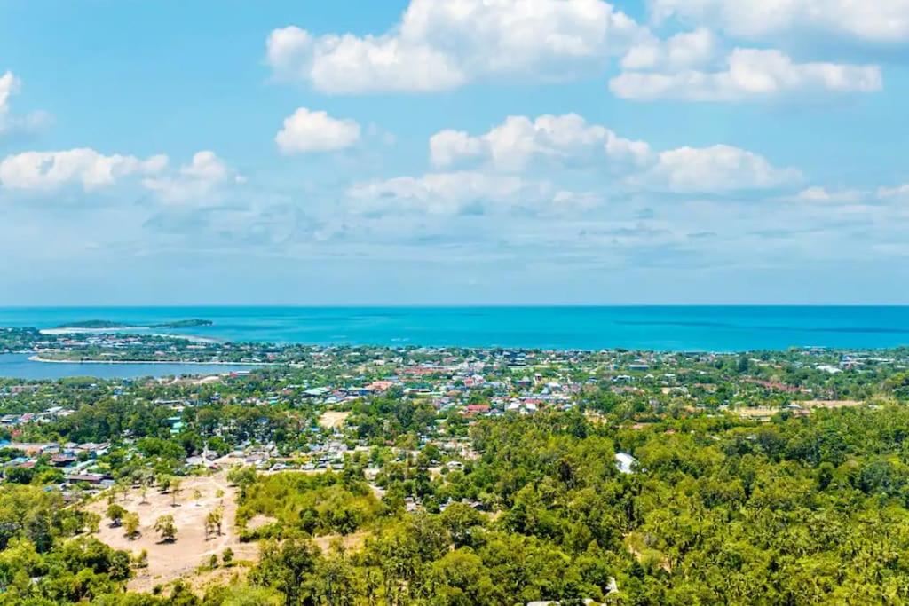 an aerial view of a city and the ocean at 25% OFF! 5 minutes to Chaweng beach in Nathon Bay