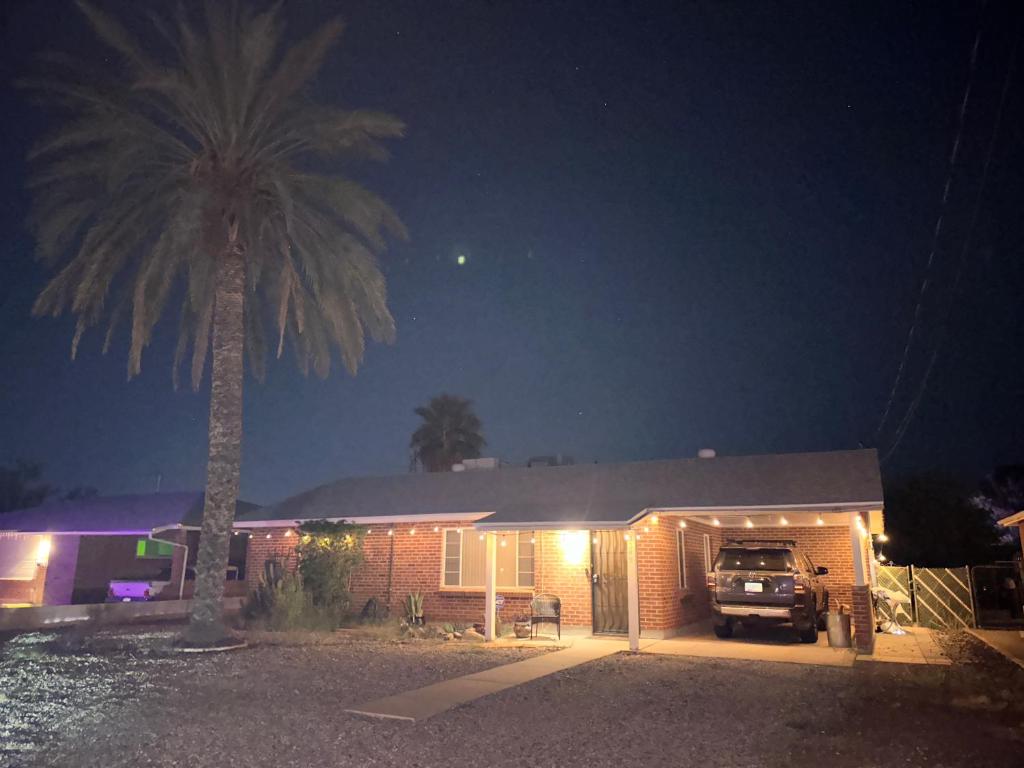 a truck parked in front of a house at night at Charming 2 Bed Mid-City Living only 7 Min to Downtown in Tucson