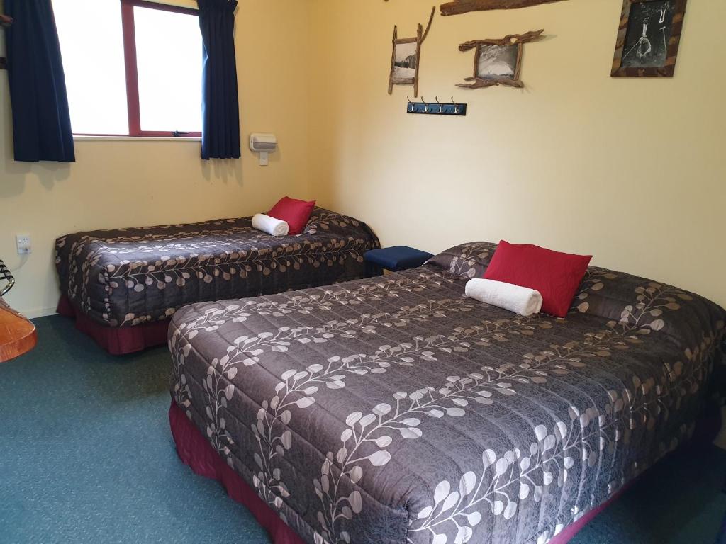 Postel nebo postele na pokoji v ubytování Glow Worm Accommodation