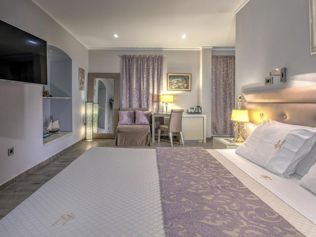 Postel nebo postele na pokoji v ubytování Fiscardonna Luxury Suites