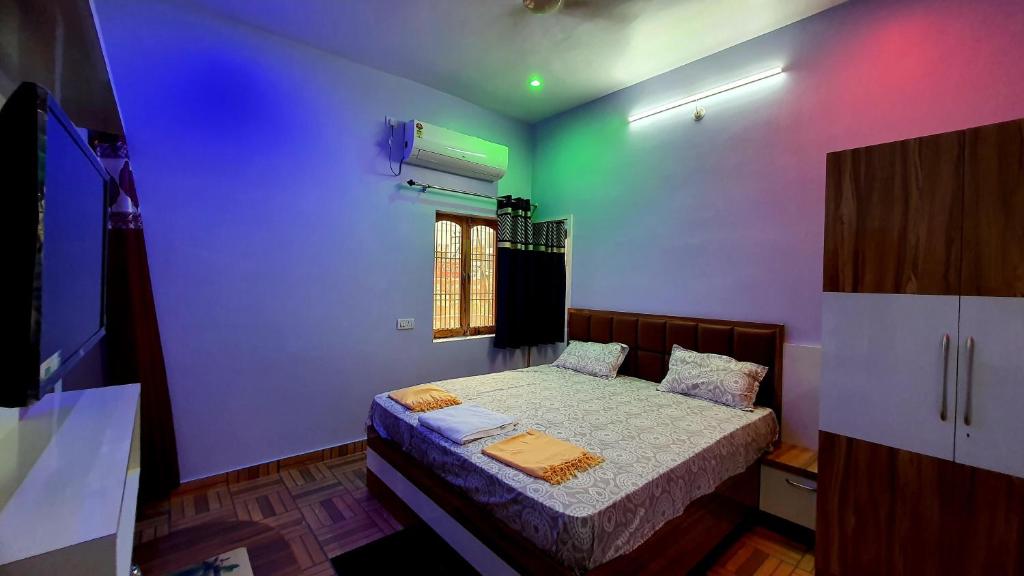 Katil atau katil-katil dalam bilik di Aananadam Homestay