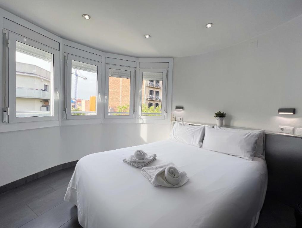 Кровать или кровати в номере Stay U-nique Apartment Creu Coberta