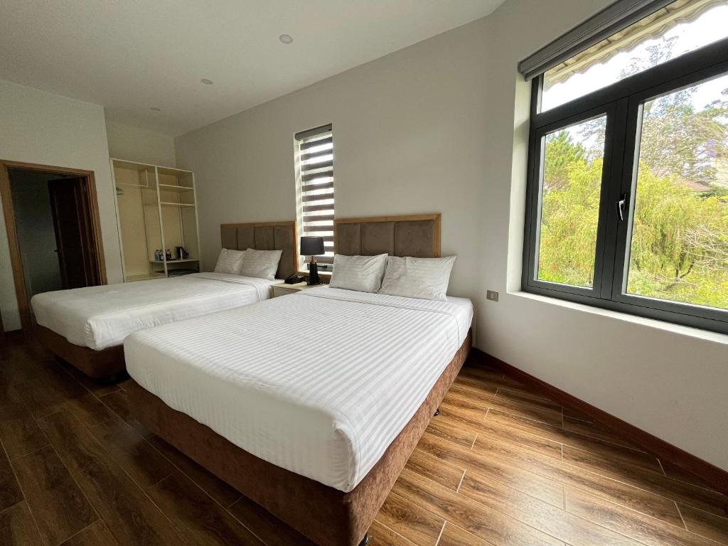 Postel nebo postele na pokoji v ubytování Hotel Du Ciel
