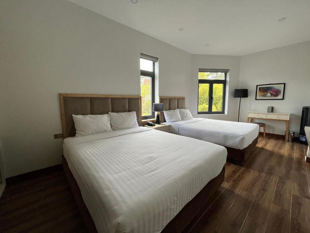 Postel nebo postele na pokoji v ubytování Hotel Du Ciel