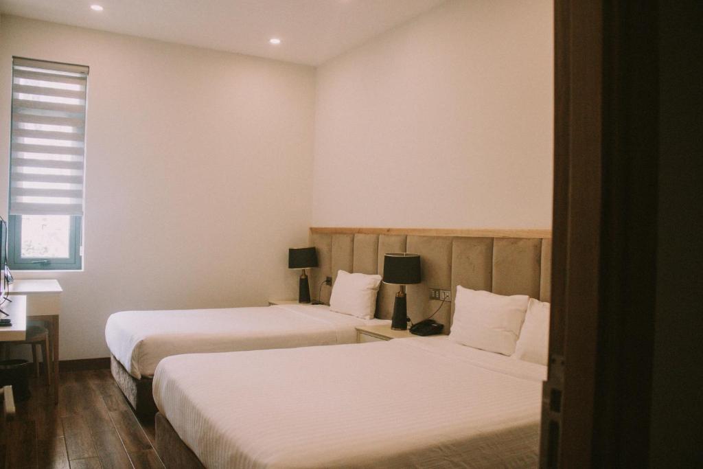 Postel nebo postele na pokoji v ubytování Hotel Du Ciel